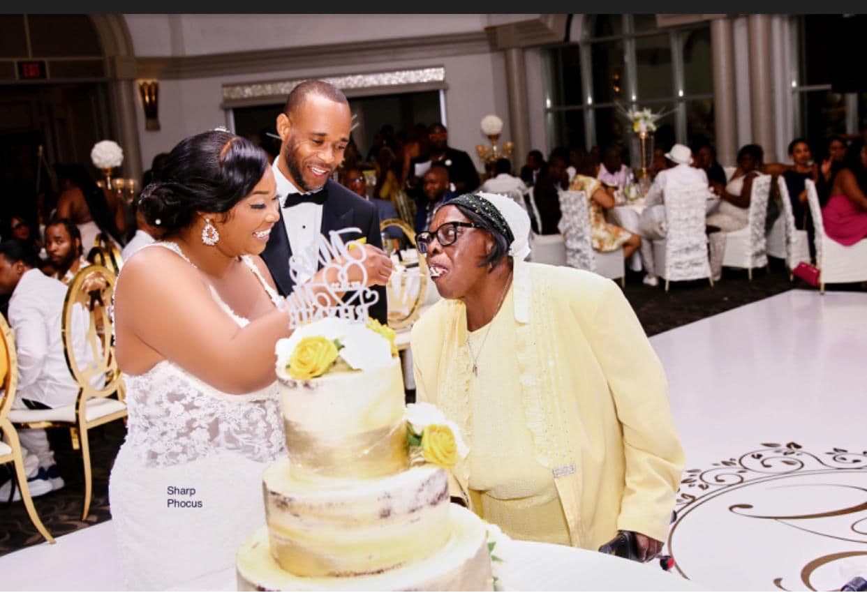 Couple cutting wedding cake