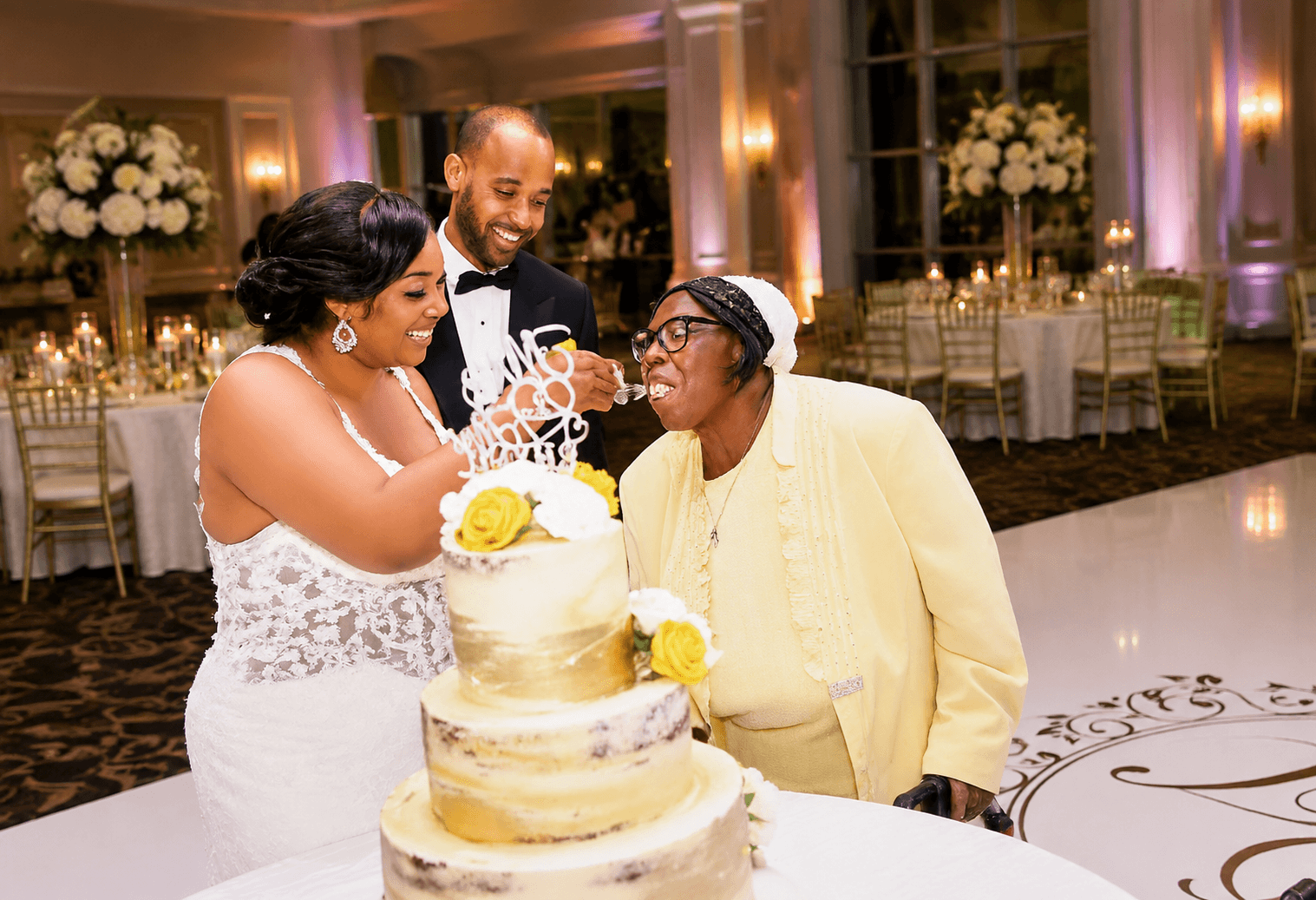 Couple cutting wedding cake